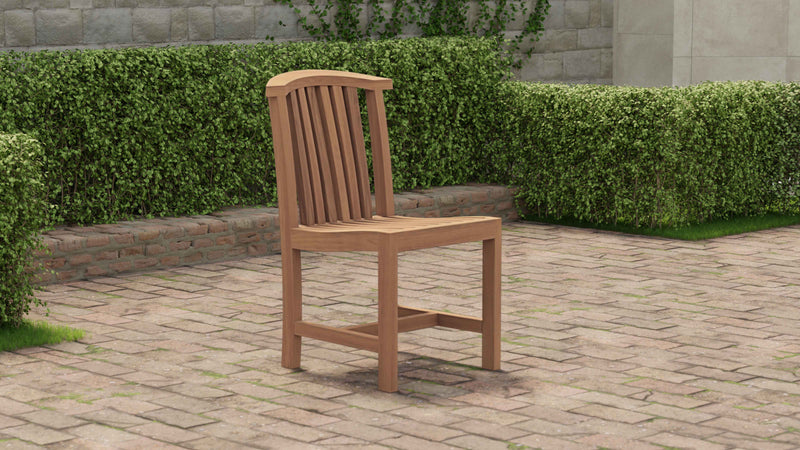 Slatted teak dining chair against a hedge