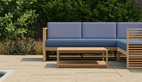 Buckingham Teak Outdoor Modular Furniture Showing Close Up of L Shaped Sofa with Square Coffee Table in Paris Fabric - Navy Seat Cushions & Cornflower Back Cushions