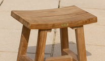 Rectangular teak stool on patio