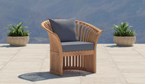 Ascot Teak Outdoor Lounge Chair Shown with Cornflower Cushions 