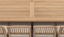 Close Up Detail Showing Edge of Table & Chairs with Ecru Cushions