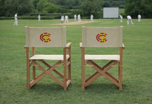 Two MCC Teak Directors Chair s Overlooking A Cricket Match