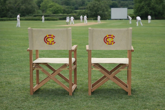 Two MCC Teak Directors Chair s Overlooking A Cricket Match
