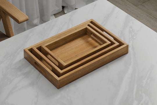 A Set of 3 Rectangular Teak Trays with Slotted Handle