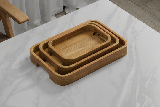 A Set of 3 Rectangular Teak Trays with Curved Corners and Integral Handle