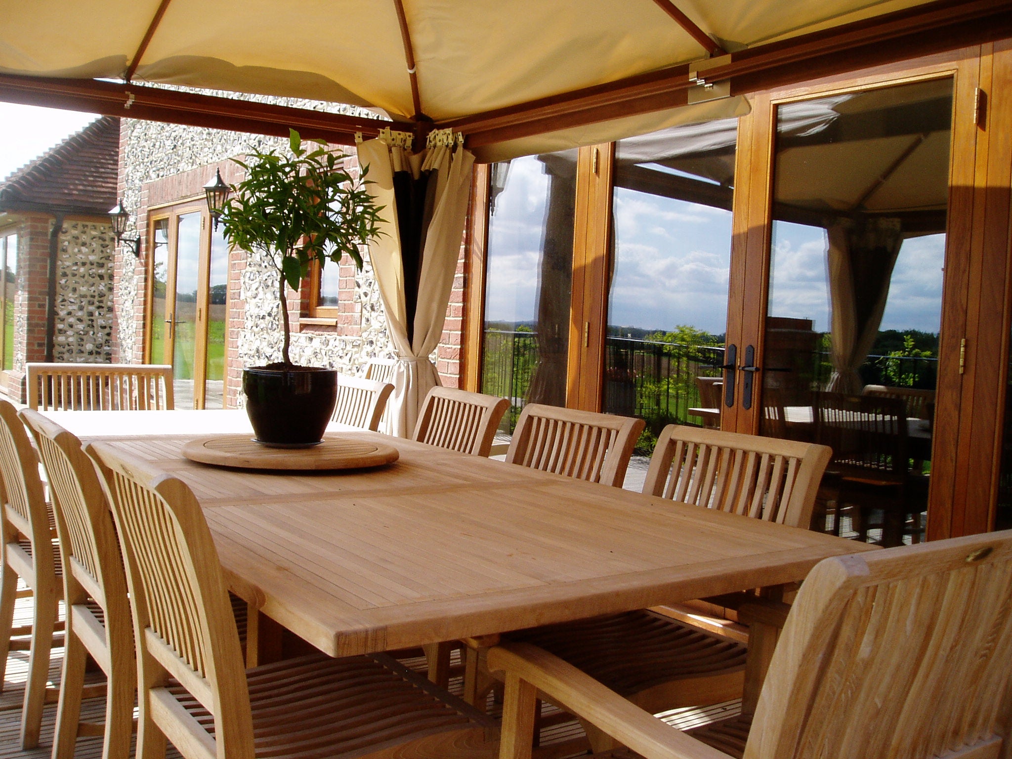 Rectangular extending teak garden and patio table & chairs