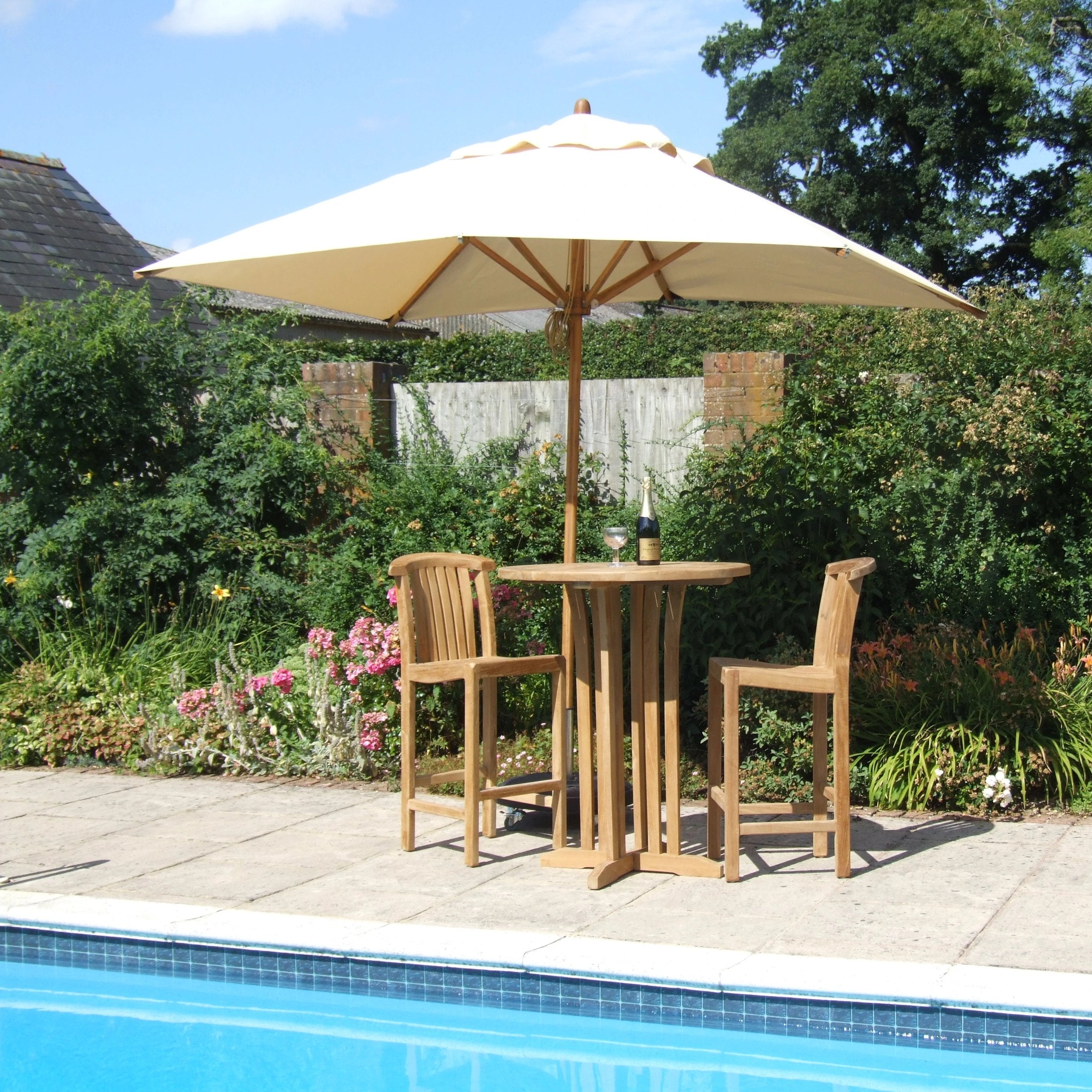 Teak Bar Table with Winchester Bar Chairs by the pool 